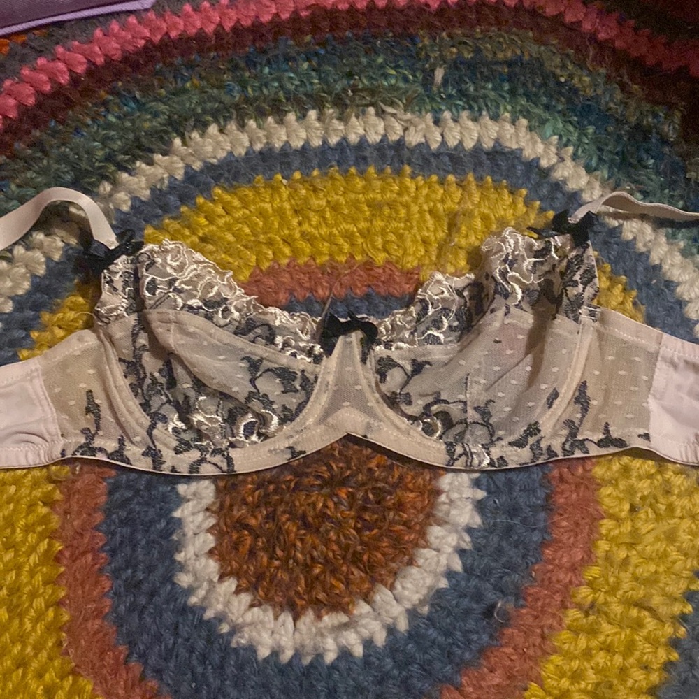 Lacy black and light pink bra